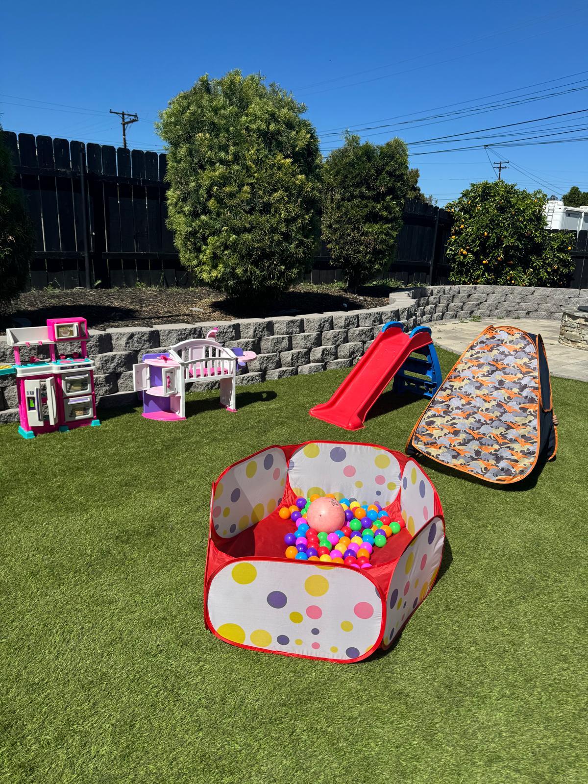 Backyard playset with slide and swings