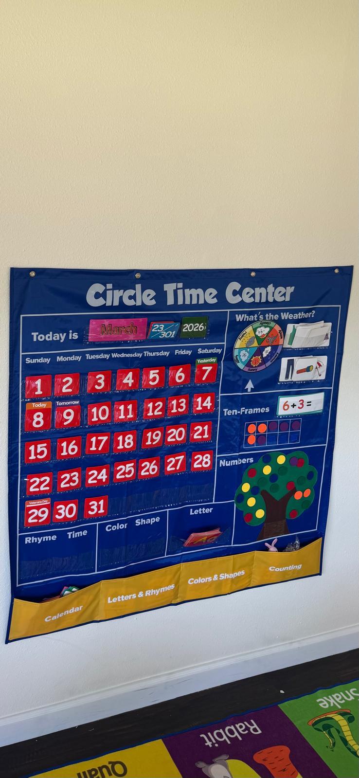 Indoor classroom from another angle showing colorful bins